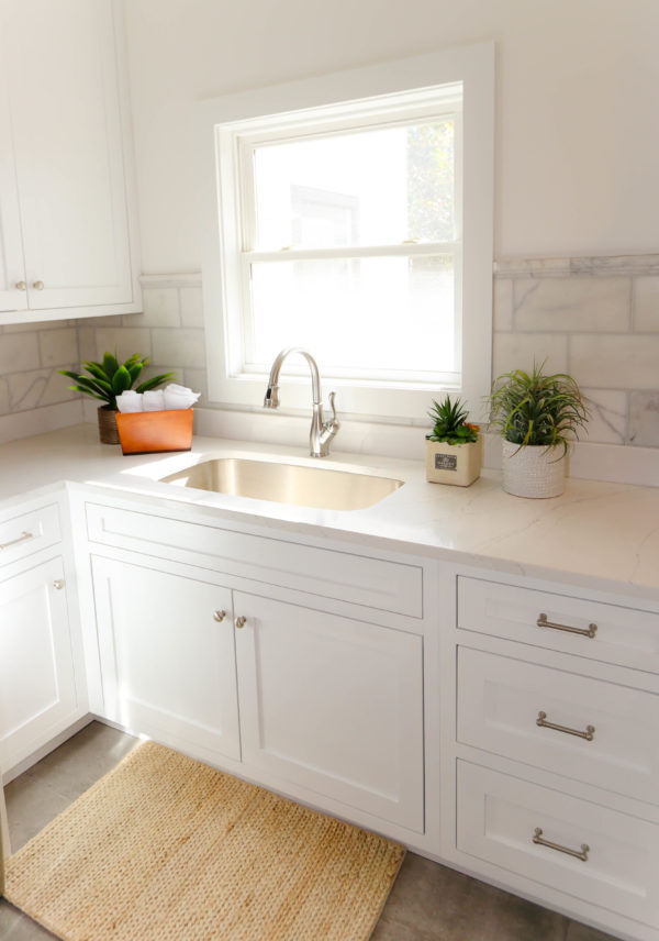 white cabinets, marble, tile, backsplash, remodel, laundry room, sink