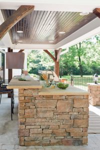 Outdoor Kitchen Under Pavilion with Wood Ceiling and Lighting 