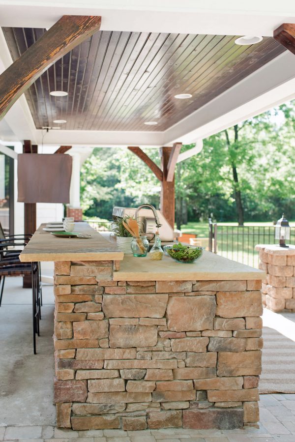 Outdoor Kitchen Under Pavilion with Wood Ceiling and Lighting